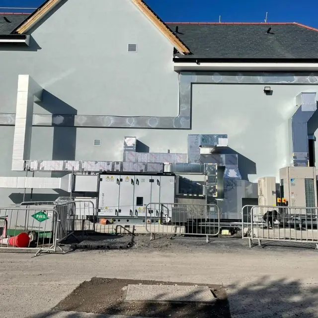 External plant compound at Adidas, Kildare Village: AHU, insulated ductwork and Daikin VRV outdoor units on a gable wall