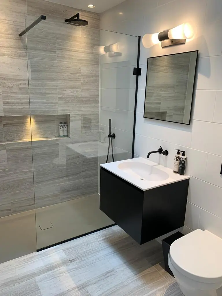 Hampstead residence shower room with walk-in glass shower, black rainhead and brassware, and wall-hung black vanity